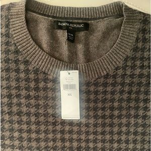 Khaki color herringbone pattern sweater.